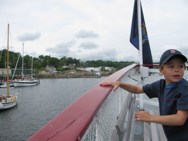 Colby Terry, 8, of Prospect, stands at the bow of the steam ferry replica Patience as his aunt, Captain Melissa Welch, prepares to dock the 72-foot long boat at Thompson's Wharf in Belfast. Colby Terry, 8, of Prospect, stands at the bow of the steam ferry replica Patience as his aunt, Captain Melissa Welch, prepares to dock the 72-foot long boat at Thompson's Wharf in Belfast.