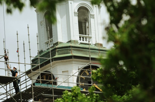 A worker stretches to reach a hook on a crane while working on the historic Hammdond Street Congregational Church on Thursday, June 2. 2011. The church steeple, which houses a Verizon cell antenna, is having major repairs done on it. The church is also looking to raise money to make the rear of the building and the Arthur Little Building handicap accessible. A worker stretches to reach a hook on a crane while working on the historic Hammdond Street Congregational Church on Thursday, June 2. 2011. The church steeple, which houses a Verizon cell antenna, is having major repairs done on it. The church is also looking to raise money to make the rear of the building and the Arthur Little Building handicap accessible.