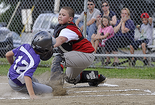 Holbrook's catcher Nate Galinski tags out Hampden's Tyler Knights at the plate during the first inning their Little League All-Star game at Knights of Columbus field in Old Town Tuesday, July 5, 2011. Holbrook's catcher Nate Galinski tags out Hampden's Tyler Knights at the plate during the first inning their Little League All-Star game at Knights of Columbus field in Old Town Tuesday, July 5, 2011.