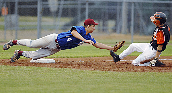 Bangor third baseman Nic Ashey tags out Brewer's Ian Forrest on an attempted steal in third-inning action of the District 3 Senior League championship game at Mansfield Stadium in Bangor Tuesday night. Brewer beat Bangor 4-2 to win the title. Bangor third baseman Nic Ashey tags out Brewer's Ian Forrest on an attempted steal in third-inning action of the District 3 Senior League championship game at Mansfield Stadium in Bangor Tuesday night. Brewer beat Bangor 4-2 to win the title.