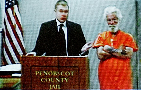 A video screen displays Edward Myshrall, right, and his attorney Aaron Frey during Myshrall's video appearance before Superior Court Justice Kirk Studstrup at Penobscot Judicial Center in Bangor Wednesday afternoon, July 13, 2011. Myshrall, 52 of Bangor made his initial court appearance was charged with aggravated assault and failure to submit to arrest earlier this week. A video screen displays Edward Myshrall, right, and his attorney Aaron Frey during Myshrall's video appearance before Superior Court Justice Kirk Studstrup at Penobscot Judicial Center in Bangor Wednesday afternoon, July 13, 2011. Myshrall, 52 of Bangor made his initial court appearance was charged with aggravated assault and failure to submit to arrest earlier this week.
