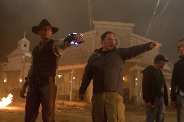 Daniel Craig as a stranger with no memory of his past and director-executive producer Jon Favreau on the set of "Cowboys & Aliens." Daniel Craig as a stranger with no memory of his past and director-executive producer Jon Favreau on the set of "Cowboys & Aliens."