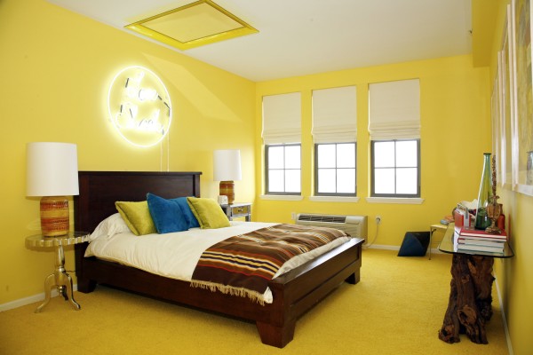 This undated photo courtesy of HGTV shows a room designed by Cortney and Robert Novogratz, from HGTV's "Home by Novogratz," in a home in Long Branch, N.J. Many homeowners are trying out the bold, unexpected use of color that high-profile designers have been preaching. This undated photo courtesy of HGTV shows a room designed by Cortney and Robert Novogratz, from HGTV's "Home by Novogratz," in a home in Long Branch, N.J. Many homeowners are trying out the bold, unexpected use of color that high-profile designers have been preaching.