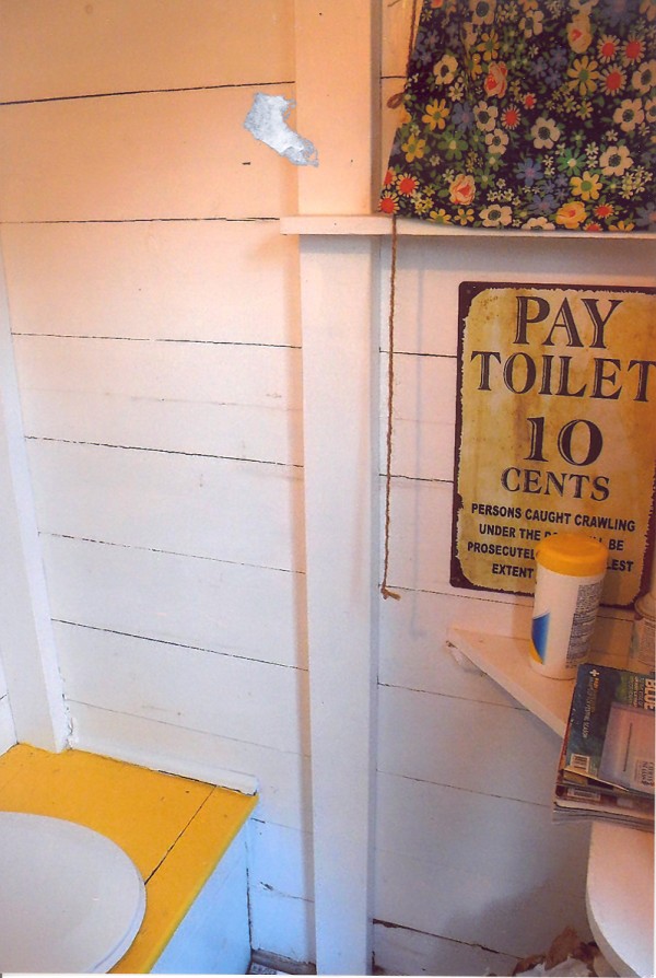 I am an outhouse located at Beech Hill Pond. I have had three owners over the years. I was born in 1950 on the West Shore Road and have had many good years. There are many attributes that make me a unique outhouse. I am able to host two users at the same time, I have electricity, I am painted and decorated, and now I have a new tiled floor. But I have not always been so impressive.
During my life with my second owner, I began to deteriorate. I need a new skirt, new paint, roof work, and most of all a new floor. On the 4th of July celebrations of 2000, I was hosting two users. When they were doing their thing, my floor gave way and the larger of the two woman dropped six feet to the bottom of the outhouse. It required a ladder to get her out.
Needless to say, the lady never returned to visit me and shortly after this traumatic event the camp was sold to the current owners. They have turned me around and given me a second life. I now have new paint inside and out, a new skirt, better lighting and most importantly a new floor to host my guests.
With my second chance of life I feel I am one of the best outhouses out there. I have many friends on Beech Hill Pond, and I am by far the most attractive outhouse of them all.