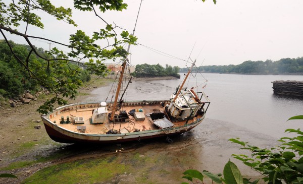 The Roamer rests in the mud along the west bank of the Penobscot River in Hampden on Thursday, July 21. The Roamer rests in the mud along the west bank of the Penobscot River in Hampden on Thursday, July 21.