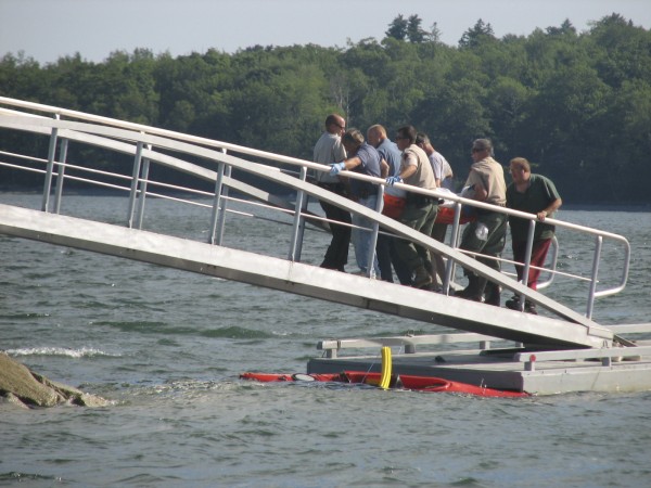 Police, paramedics and firefighters carry the body of a New Hampshire man up a ramp at Lamoine State Park on Sunday afternoon, July 10, 2011, after it was recovered from Eastern Bay, between Lamoine and Mount Desert Island. Police, paramedics and firefighters carry the body of a New Hampshire man up a ramp at Lamoine State Park on Sunday afternoon, July 10, 2011, after it was recovered from Eastern Bay, between Lamoine and Mount Desert Island.
