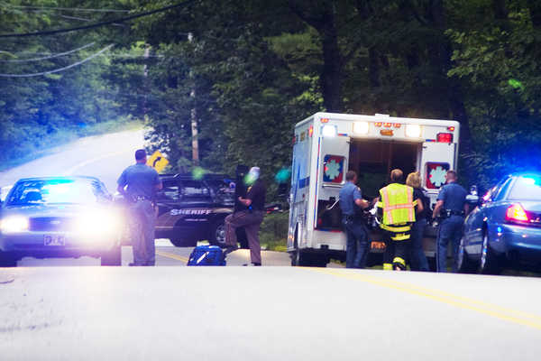 Rescue personnel load an injured person into an ambulance after a shooting at 322 Bennett Road in New Gloucester just before 7:30 p.m. Monday. A second person was also shot, police said. Rescue personnel load an injured person into an ambulance after a shooting at 322 Bennett Road in New Gloucester just before 7:30 p.m. Monday. A second person was also shot, police said.