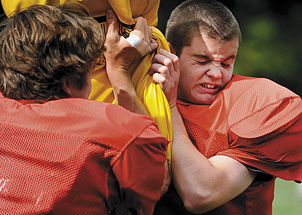 Camden Hills' Chris Weiss (right) reacts as he participates with teammate Chandler Crans during a blocking drill in a recent practice in Rockport. Camden HIlls opens its season on Saturday at 1:30 p.m. when it hosts Morse of Bath. Camden Hills' Chris Weiss (right) reacts as he participates with teammate Chandler Crans during a blocking drill in a recent practice in Rockport. Camden HIlls opens its season on Saturday at 1:30 p.m. when it hosts Morse of Bath.
