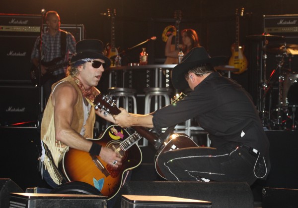 Big & Rich strums it out down low during the Aroostook County portion of the their Xtreme Muzik tour with Gretchen Wilson (background, right). Big & Rich strums it out down low during the Aroostook County portion of the their Xtreme Muzik tour with Gretchen Wilson (background, right).