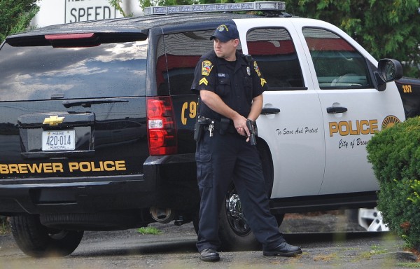 With gun drawn, Brewer Police Cpl. Nelson Feero, helps secure the perimeter of the Cozy Inn in Brewer as fellow officers with his department and the Penobscot County Sheriffs Department made an arrest there Friday afternoon, Aug. 19, 2011. With gun drawn, Brewer Police Cpl. Nelson Feero, helps secure the perimeter of the Cozy Inn in Brewer as fellow officers with his department and the Penobscot County Sheriffs Department made an arrest there Friday afternoon, Aug. 19, 2011.
