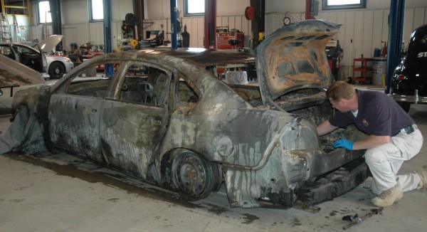An investigator from the federal bureau of Alcohol, Tobacco and Firearms joined Fire Marshals Thursday in the investigation of the arson fire that destroyed the state-owned car of Fire Marshal Sgt. Tim York. Here, ATF Agent John Morris (no relation to Commissioner Morris) gathers items from the charred remains of the 2009 Impala torched early Wednesday morning as the car was parked along a rural road in Prentiss. Charged with arson is a nearby resident — 53-year-old John Weckerly. An investigator from the federal bureau of Alcohol, Tobacco and Firearms joined Fire Marshals Thursday in the investigation of the arson fire that destroyed the state-owned car of Fire Marshal Sgt. Tim York. Here, ATF Agent John Morris (no relation to Commissioner Morris) gathers items from the charred remains of the 2009 Impala torched early Wednesday morning as the car was parked along a rural road in Prentiss. Charged with arson is a nearby resident — 53-year-old John Weckerly.