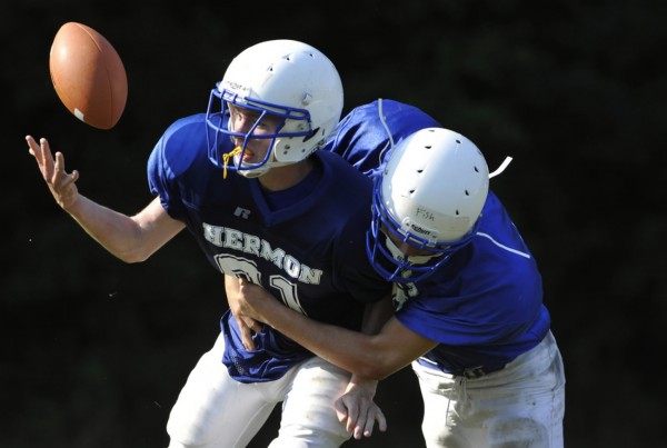 Colin Hewes (left) focuses on the ball as Connor Fish moves in for the tackle during a recent passing drill at a Hermon High School practice. Hermon plays its first varsity game on the road against Dexter on Saturday at 1 p.m. Colin Hewes (left) focuses on the ball as Connor Fish moves in for the tackle during a recent passing drill at a Hermon High School practice. Hermon plays its first varsity game on the road against Dexter on Saturday at 1 p.m.