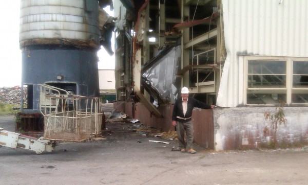 A demolition worker stands at the Loring central heat plant on Friday, August 5, 2011. The steel beams of the building are being notched to make the collapse predictable during its implosion on August 13, 2011. A demolition worker stands at the Loring central heat plant on Friday, August 5, 2011. The steel beams of the building are being notched to make the collapse predictable during its implosion on August 13, 2011.