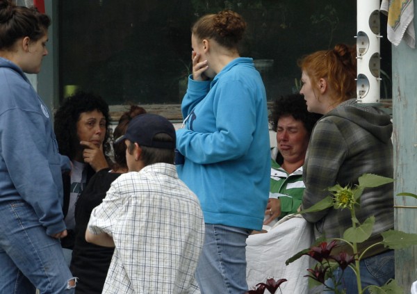 Family and friends of Celina Cass wait on the porch of the family home in Stewartstown, N.H., Wednesday, July 27, 2011. Cass, 11, who disappeared almost a week ago was discovered Monday, Aug. 1, in a river less than half a mile from her home, authorities said. The death was being considered suspicious. Family and friends of Celina Cass wait on the porch of the family home in Stewartstown, N.H., Wednesday, July 27, 2011. Cass, 11, who disappeared almost a week ago was discovered Monday, Aug. 1, in a river less than half a mile from her home, authorities said. The death was being considered suspicious.
