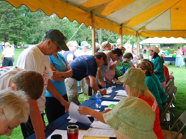 Volunteers register Saturday, Aug. 27, for the fourth annual Bangor Walk to Defeat ALS, which drew more than 300 walkers for the 1.3- and 2.3-mile benefit walks.
Volunteers register Saturday, Aug. 27, for the fourth annual Bangor Walk to Defeat ALS, which drew more than 300 walkers for the 1.3- and 2.3-mile benefit walks.
