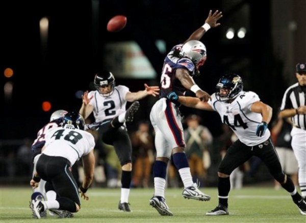 New England Patriots linebacker Jermaine Cunningham (96) jumps in an attempt to block a punt by Jacksonville Jaguars punter Durant Brooks (2) as fullback Brock Bolen (44) defends during an NFL preseason football game in Foxborough, Mass., Thursday. New England Patriots linebacker Jermaine Cunningham (96) jumps in an attempt to block a punt by Jacksonville Jaguars punter Durant Brooks (2) as fullback Brock Bolen (44) defends during an NFL preseason football game in Foxborough, Mass., Thursday.