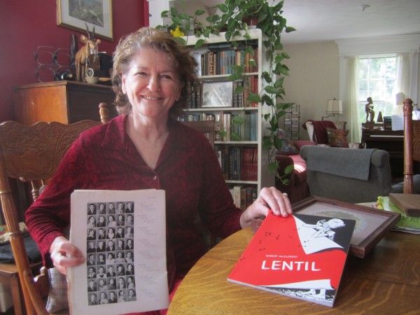 Mindy Blake with her mother’s high school yearbook from Hamilton, Ohio. Mindy’s mother and Robert McCloskey’s sister are pictured on the same page and were high school friends. In Mindy’s other hand is a Robert McCloskey book inscribed by the author’s daughter. Mindy Blake with her mother’s high school yearbook from Hamilton, Ohio. Mindy’s mother and Robert McCloskey’s sister are pictured on the same page and were high school friends. In Mindy’s other hand is a Robert McCloskey book inscribed by the author’s daughter.