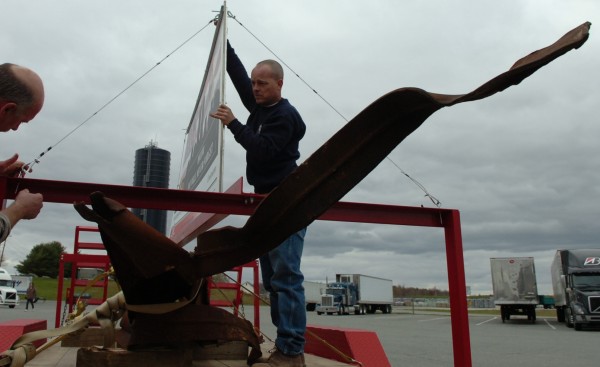 Walter Shannon (left) and Ricky Goodwin secure a sign above steel from the World Trade Center before joining a procession of fire and police vehicles in the Dysart's parking lot and taking the artifacts to their new home at the Brewer public safety building in 2008. Walter Shannon (left) and Ricky Goodwin secure a sign above steel from the World Trade Center before joining a procession of fire and police vehicles in the Dysart's parking lot and taking the artifacts to their new home at the Brewer public safety building in 2008.