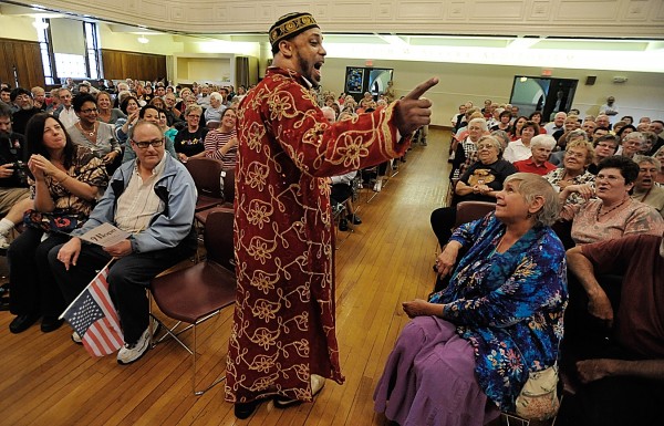 Joshua Nelson, standing, makes his way along an aisle as he and his band sing a rousing African American spiritual " Joshua FIt the Battle of Jericho" during the Gathering of Remembrance and Hope at John Bapst Memorial High School Sunday afternoon, Sept. 11, 2011. The event brought together local clergy and other residents of various faiths to remember the events shaped by the Sept. 11 attacks ten years ago. Joshua Nelson, standing, makes his way along an aisle as he and his band sing a rousing African American spiritual " Joshua FIt the Battle of Jericho" during the Gathering of Remembrance and Hope at John Bapst Memorial High School Sunday afternoon, Sept. 11, 2011. The event brought together local clergy and other residents of various faiths to remember the events shaped by the Sept. 11 attacks ten years ago.