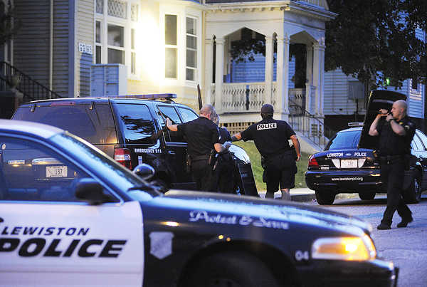 Lewiston police work at the scene of a standoff on Howe Street in Lewiston on Wednesday. Timothy B. Delisle, 37, of Auburn surrendered at about 8 p.m. and was arrested on several charges. Lewiston police work at the scene of a standoff on Howe Street in Lewiston on Wednesday. Timothy B. Delisle, 37, of Auburn surrendered at about 8 p.m. and was arrested on several charges.