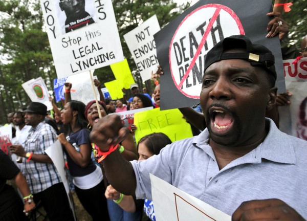 Protesters chant Anti-death penalty slogans for Georgia death row inmate Troy Davis In Jackson, Ga., Wednesday, Sept. 21, 2011. Davis is scheduled to die Wednesday for killing off-duty Savannah officer Mark MacPhail. Protesters chant Anti-death penalty slogans for Georgia death row inmate Troy Davis In Jackson, Ga., Wednesday, Sept. 21, 2011. Davis is scheduled to die Wednesday for killing off-duty Savannah officer Mark MacPhail.