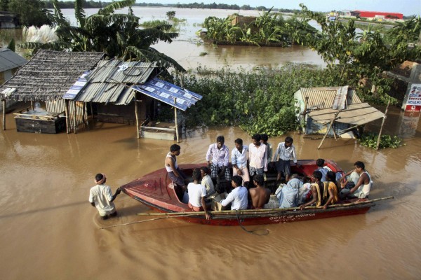 Indian villagers sit in a rescue boat in the flooded Rasulpur village in Orissa's Jajpur district, India, Monday, Sept. 26, 2011. Monsoon rains collapsed mud huts and riverbanks, flooding wide swaths of north and east India and killing at least 48 people over the weekend, officials said Monday. Indian villagers sit in a rescue boat in the flooded Rasulpur village in Orissa's Jajpur district, India, Monday, Sept. 26, 2011. Monsoon rains collapsed mud huts and riverbanks, flooding wide swaths of north and east India and killing at least 48 people over the weekend, officials said Monday.