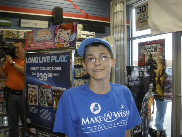 14-year-old Sam Alexander's smile lights up the room as he prepares for a shopping spree as part of his Make-A-Wish Foundation of Maine shopping spree. 14-year-old Sam Alexander's smile lights up the room as he prepares for a shopping spree as part of his Make-A-Wish Foundation of Maine shopping spree.
