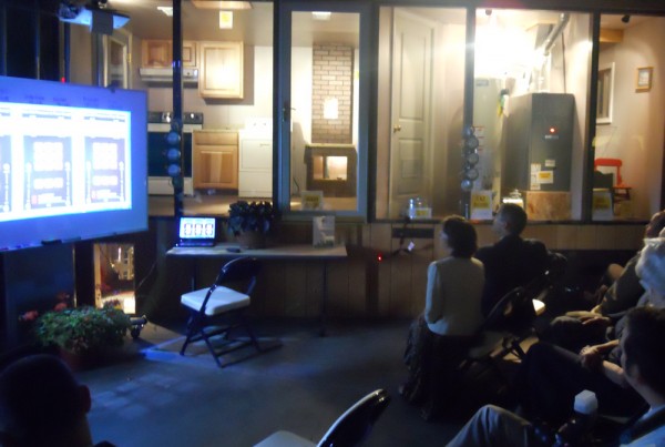 Audience members look on as SMCC's "pressure house" is lit up to show how air flow and pressure is tracked through the simulated home environment Thursday during the opening celebration for the school's new Sustainability and Energy Alternatives Center. Audience members look on as SMCC's "pressure house" is lit up to show how air flow and pressure is tracked through the simulated home environment Thursday during the opening celebration for the school's new Sustainability and Energy Alternatives Center.