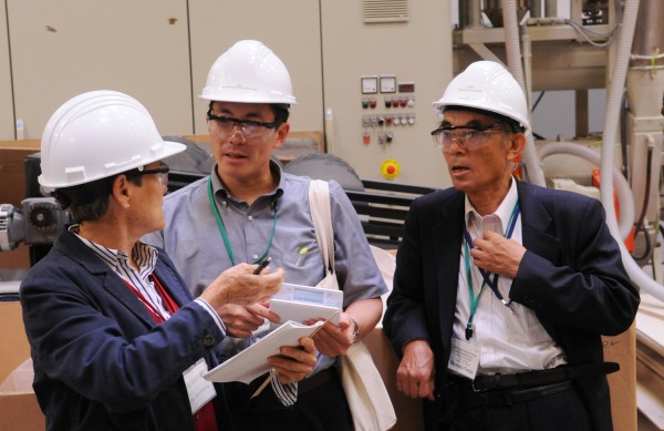Maine Housing Director Dale McCormick (from left) helps Aomori prefecture government senior staff member Yasunori Kitagawa and Hirosaki University assistant to the president Dr. Hirotada Nanjo understand an English term as they tour the Advanced Structures and Composites Center on the University of Maine campus in Orono on Thursday, Sept. 8, 2011. Maine Housing Director Dale McCormick (from left) helps Aomori prefecture government senior staff member Yasunori Kitagawa and Hirosaki University assistant to the president Dr. Hirotada Nanjo understand an English term as they tour the Advanced Structures and Composites Center on the University of Maine campus in Orono on Thursday, Sept. 8, 2011.