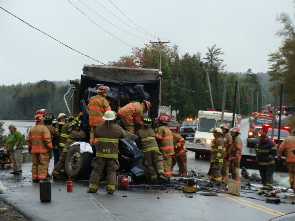 Greenville, Monson and Guilford rescue officials work to free the
driver of a dump truck that collided with a tractor-trailer truck at
about 12:30 p.m. Thursday at the sharp curve at Spectacle Pond in Monson.
Greenville, Monson and Guilford rescue officials work to free the
driver of a dump truck that collided with a tractor-trailer truck at
about 12:30 p.m. Thursday at the sharp curve at Spectacle Pond in Monson.