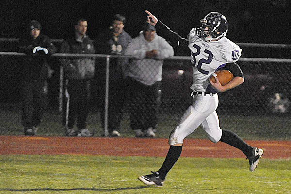 John Bapst Memorial High School running back Andrew Catlin scores the game's first touchdown in the first quarter of Friday night's game against Foxcroft Academy in Dover-Foxcroft. John Bapst Memorial High School running back Andrew Catlin scores the game's first touchdown in the first quarter of Friday night's game against Foxcroft Academy in Dover-Foxcroft.