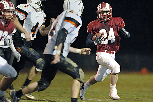 Bangor's Zeb Tuell, right, sweeps around the Skowhegan defense in the second quarter Friday night at Cameron Stadium in Bangor. Bangor's Zeb Tuell, right, sweeps around the Skowhegan defense in the second quarter Friday night at Cameron Stadium in Bangor.