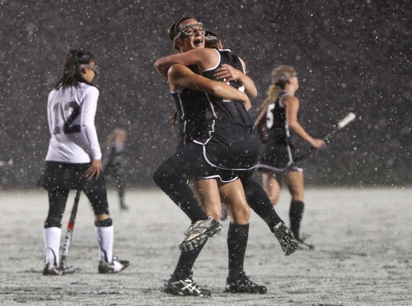 Skowhegan field hockey players Makaela Michonski, (facing camera) embraces teammate Jessica Skillings after their team defeated Marshwood in the snow for the state championship, in Yarmouth on Saturday, Oct. 29, 2011. Skowhegan field hockey players Makaela Michonski, (facing camera) embraces teammate Jessica Skillings after their team defeated Marshwood in the snow for the state championship, in Yarmouth on Saturday, Oct. 29, 2011.