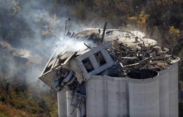 Smoke rises from the damaged headhouse area of the Bartlett Grain elevator in Atchison, Kan., on Sunday, Oct. 30, 2011. Crews suspended their search Sunday for three people missing after a thunderous explosion at the grain elevator killed three workers and hospitalized two others with severe burns. Smoke rises from the damaged headhouse area of the Bartlett Grain elevator in Atchison, Kan., on Sunday, Oct. 30, 2011. Crews suspended their search Sunday for three people missing after a thunderous explosion at the grain elevator killed three workers and hospitalized two others with severe burns.