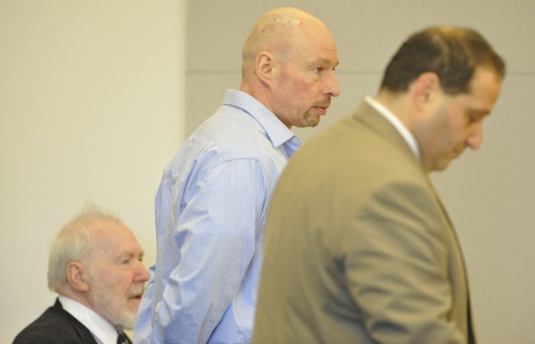 Standing between his attorney Joseph Baldacci (right) and German language interpreter Jiri George Drobny (seated), Horst Wolk, listens to Superior Court Justice William R. Anderson (not pictured) impose his sentence at Penobscot Judical Center Wednesday, Oct. 5, 2011. Wolk received a 10-year sentence for aggravated assault, criminal threatening and violation of a protection order. The charges stemmed from his confrontation with his then-wife in a Husson University parking lot in which his wife was stabbed with a knife. Standing between his attorney Joseph Baldacci (right) and German language interpreter Jiri George Drobny (seated), Horst Wolk, listens to Superior Court Justice William R. Anderson (not pictured) impose his sentence at Penobscot Judical Center Wednesday, Oct. 5, 2011. Wolk received a 10-year sentence for aggravated assault, criminal threatening and violation of a protection order. The charges stemmed from his confrontation with his then-wife in a Husson University parking lot in which his wife was stabbed with a knife.