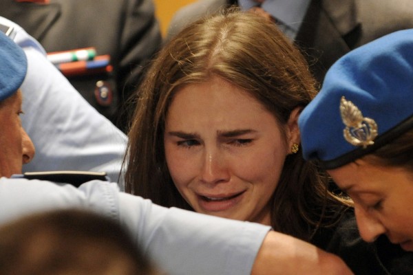 Amanda Knox cries after hearing the verdict that overturns her conviction and acquits her of murdering her British roomate Meredith Kercher, at the Perugia court, Italy, Monday Oct. 3, 2011. Amanda Knox cries after hearing the verdict that overturns her conviction and acquits her of murdering her British roomate Meredith Kercher, at the Perugia court, Italy, Monday Oct. 3, 2011.