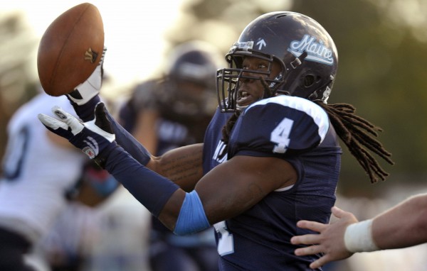 Maine linebacker Vinson Givans (4) collects a tipped Rhode Island pass inside the 10-yard line to take in for a touchdown during the second half of an NCAA college football game in Orono, Maine on Saturday, Oct. 15, 2011. Maine linebacker Vinson Givans (4) collects a tipped Rhode Island pass inside the 10-yard line to take in for a touchdown during the second half of an NCAA college football game in Orono, Maine on Saturday, Oct. 15, 2011.