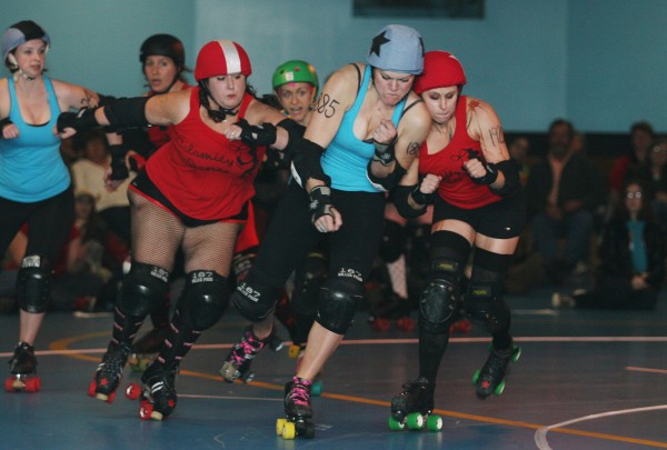 The Stone Quarry Vixens' Bristol Smashin (center) collides with Crazy Buchanan (right) of the Calamity Janes as Cherry Clobber (left) approaches during a Maine Roller Derby event Saturday. The Stone Quarry Vixens' Bristol Smashin (center) collides with Crazy Buchanan (right) of the Calamity Janes as Cherry Clobber (left) approaches during a Maine Roller Derby event Saturday.