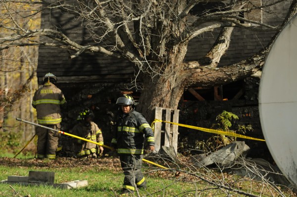 Dexter firefighters clean up after battling a blaze at a home on 173 Shore Road in Dexter on Friday, October 28, 2011. The home was the location of a murder-sucide when Steven Lake shot and killed his wife, Amy, and their children, Monica, 12, and Coty, 13, before killing himself on June 13, 2011. Dexter firefighters clean up after battling a blaze at a home on 173 Shore Road in Dexter on Friday, October 28, 2011. The home was the location of a murder-sucide when Steven Lake shot and killed his wife, Amy, and their children, Monica, 12, and Coty, 13, before killing himself on June 13, 2011.