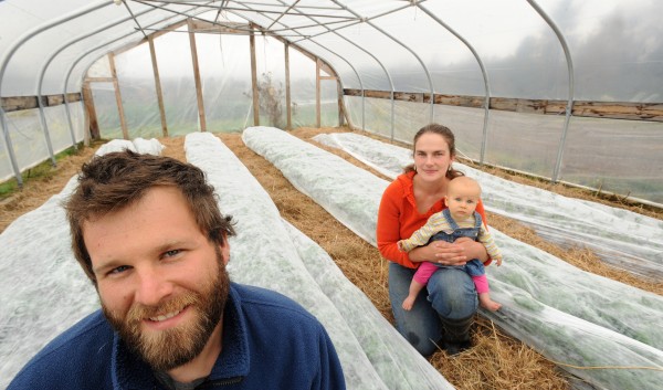 Mike and Christa Bahner with their 7-month-old daughter Elizabeth at their Belmont farm. The Bahners could be among the local farmers who benefit from a new savings account program designed so people can put aside money to join a Community Supported Agriculture program. The Bahner Farm has about 30 CSA members who receive over 15 different vegetables over the growing season. Mike and Christa Bahner with their 7-month-old daughter Elizabeth at their Belmont farm. The Bahners could be among the local farmers who benefit from a new savings account program designed so people can put aside money to join a Community Supported Agriculture program. The Bahner Farm has about 30 CSA members who receive over 15 different vegetables over the growing season.