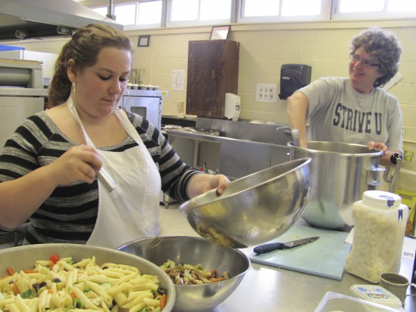 Alicia Wilpur, 17, of Windham, a student at The Real School in Falmouth, is part of a group of students who prepare lunch for dozens of students and staff members at the Real School and the Gov. Baxter School for the Deaf in Falmouth. Looking on is Della Parker, a Portland restaurant owner and volunteer at The Real School. Alicia Wilpur, 17, of Windham, a student at The Real School in Falmouth, is part of a group of students who prepare lunch for dozens of students and staff members at the Real School and the Gov. Baxter School for the Deaf in Falmouth. Looking on is Della Parker, a Portland restaurant owner and volunteer at The Real School.