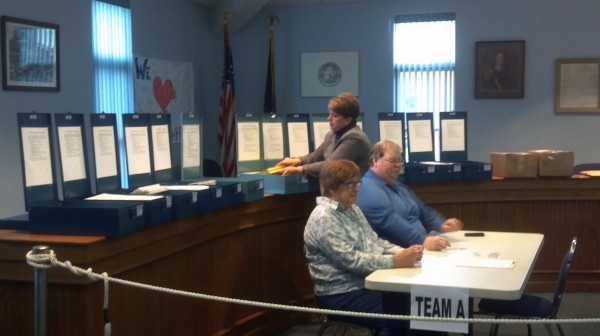 Hampden town clerk Denise Hodsdon opens 14 previously sealed and locked ballot boxes from the town's Nov. 8 election to begin a Monday recount of ballots and votes for the District 2 council race. Hampden town clerk Denise Hodsdon opens 14 previously sealed and locked ballot boxes from the town's Nov. 8 election to begin a Monday recount of ballots and votes for the District 2 council race.
