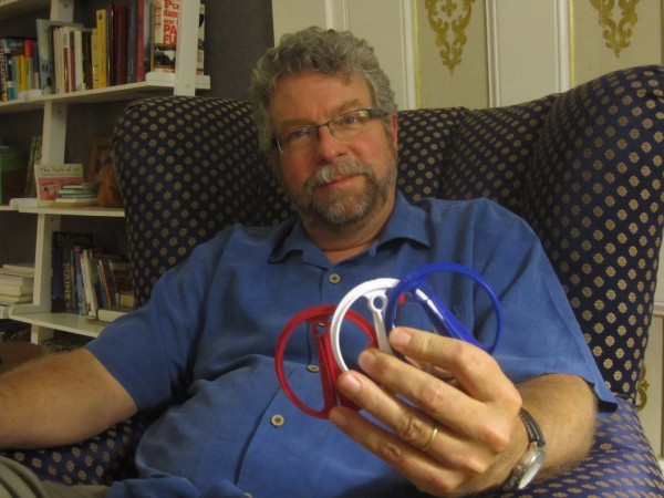 Charley Earley holding three of his new smart clips, for clotheslines and more. Charley Earley holding three of his new smart clips, for clotheslines and more.
