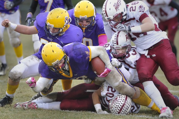 Bucksport High School's Shawn Smith tries to plow past Orono High School's Collin Clement (28), Justin Szeker (83) and Dominic Mowrer (20, bottom) on a carry in the fourth quarter of their Eastern Maine LTC Class C Championship in Bucksport Saturday afternoon, Nov. 12, 2011. Golden Buck teammates James Comtois (top left), and Mike York hover for protection. Bucksport defeated Orono 25-14. Bucksport High School's Shawn Smith tries to plow past Orono High School's Collin Clement (28), Justin Szeker (83) and Dominic Mowrer (20, bottom) on a carry in the fourth quarter of their Eastern Maine LTC Class C Championship in Bucksport Saturday afternoon, Nov. 12, 2011. Golden Buck teammates James Comtois (top left), and Mike York hover for protection. Bucksport defeated Orono 25-14.