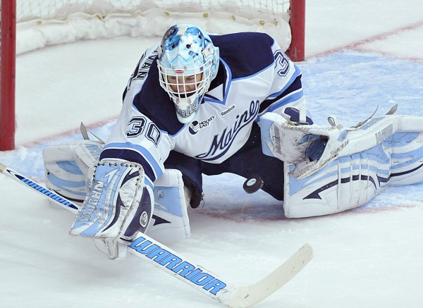 Dan Sullivan makes a save on a short that got between his pads during the first period of a game in Orono against Northeastern on Oct. 7, 2011. Maine won 6-3. Dan Sullivan makes a save on a short that got between his pads during the first period of a game in Orono against Northeastern on Oct. 7, 2011. Maine won 6-3.