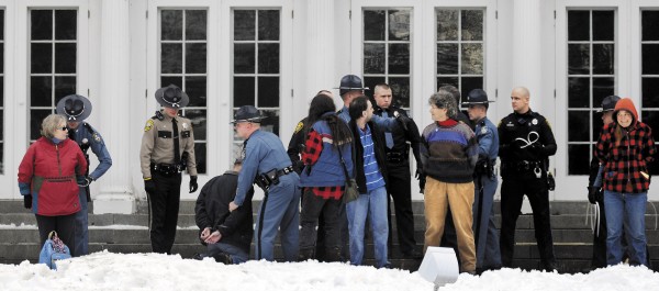 Protesters are arrested on the lawn of the Blaine House during a rally by Occupy Augusta, Sunday, Nov. 27, 2011, in Augusta. Police say eight people were charged with criminal trespass and failure to disperse after refusing to leave the lawn of the governor's mansion. Protesters are arrested on the lawn of the Blaine House during a rally by Occupy Augusta, Sunday, Nov. 27, 2011, in Augusta. Police say eight people were charged with criminal trespass and failure to disperse after refusing to leave the lawn of the governor's mansion.