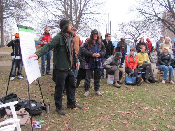Jonah Fertig goes over the agenda for a meeting Sunday, Nov. 27, 2011, among OccupyMaine activists. The goal of the meeting was for the group to decide what steps it will take next in terms of remaining at Lincoln Park. Jonah Fertig goes over the agenda for a meeting Sunday, Nov. 27, 2011, among OccupyMaine activists. The goal of the meeting was for the group to decide what steps it will take next in terms of remaining at Lincoln Park.