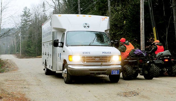 Wardens stop to speak with a Maine State Police mobile command unit approaching the scene of a shooting on Cedar Lane in Rumford on Thursday. Wardens stop to speak with a Maine State Police mobile command unit approaching the scene of a shooting on Cedar Lane in Rumford on Thursday.