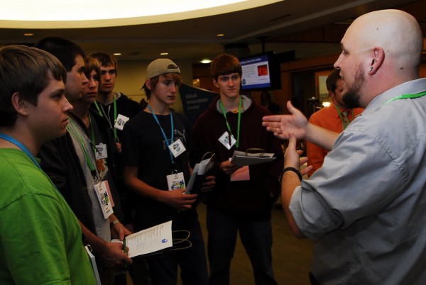 Dan Allen, a developer in Unum's Data Warehouse, talks to a half dozen high school students about using Google analytics to monitor users on a website at the company's Tech Night on Nov. 15, 2011. Dan Allen, a developer in Unum's Data Warehouse, talks to a half dozen high school students about using Google analytics to monitor users on a website at the company's Tech Night on Nov. 15, 2011.