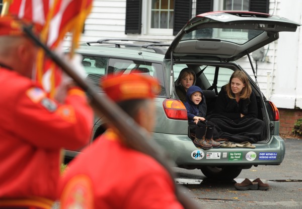 Iyisa Gardner (right) and her children, Daniel, 4, and Christopher, 10, watch the Veterans Day parade from the comfort of their hatchback along Wilson Street in Brewer on Friday, November 11, 2011. Iyisa Gardner (right) and her children, Daniel, 4, and Christopher, 10, watch the Veterans Day parade from the comfort of their hatchback along Wilson Street in Brewer on Friday, November 11, 2011.